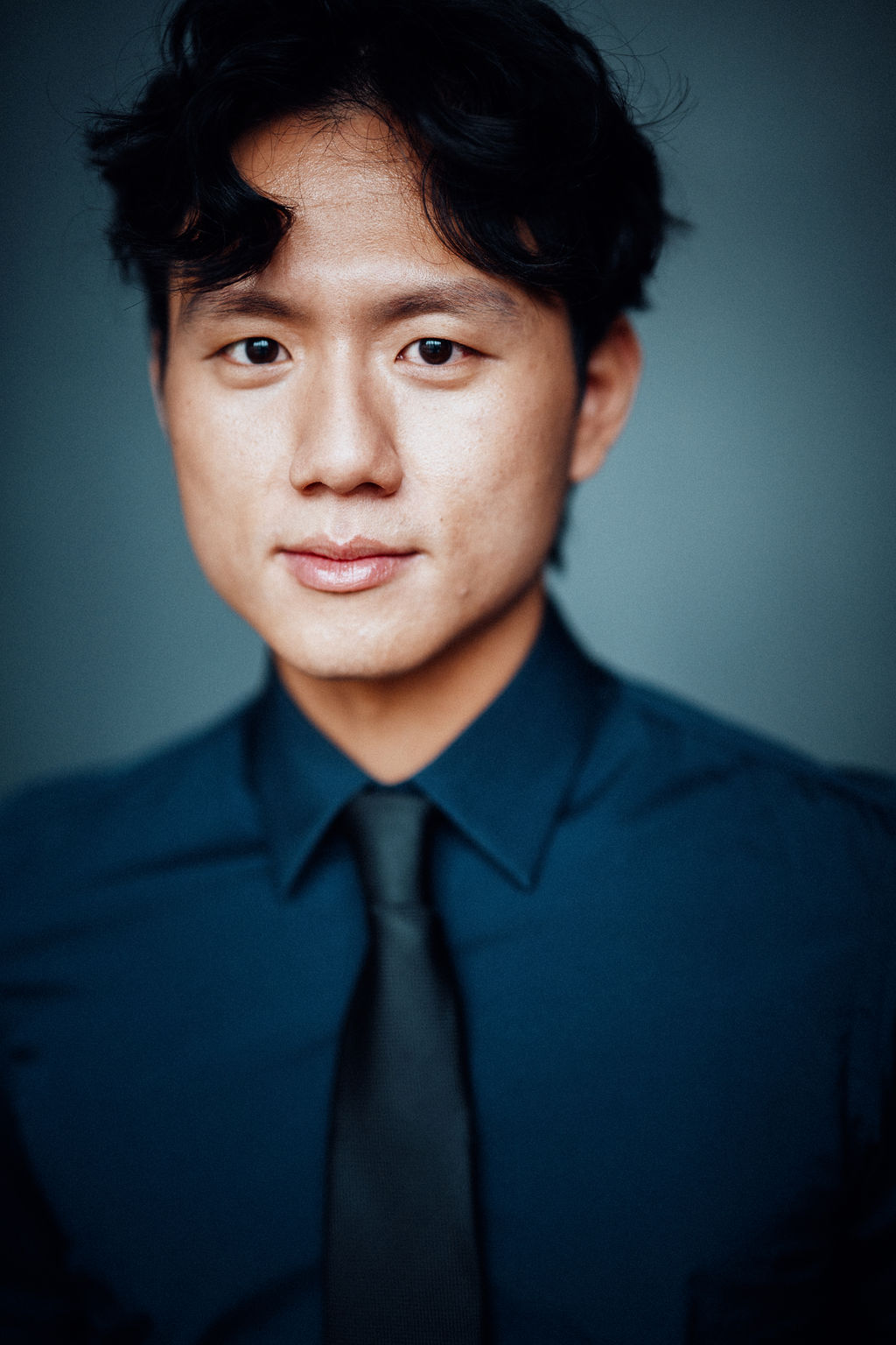 Sang Hun Kim headshot long hair