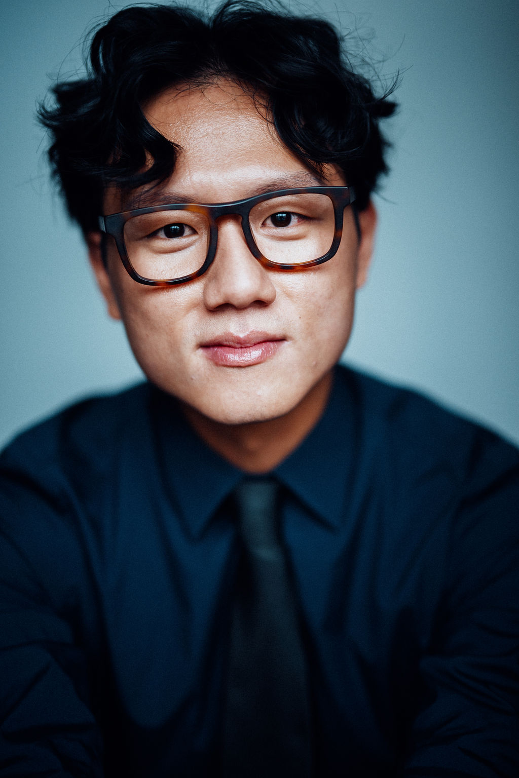 Sang Hun Kim headshot long hair